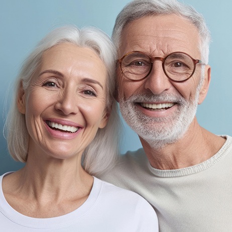 Smiling senior couple, both with nice teeth