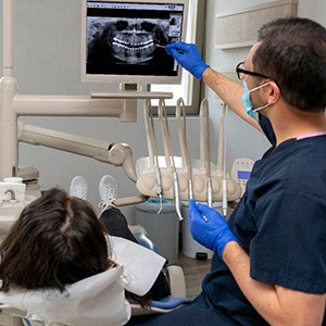 Dentist showing patient her X-rays 