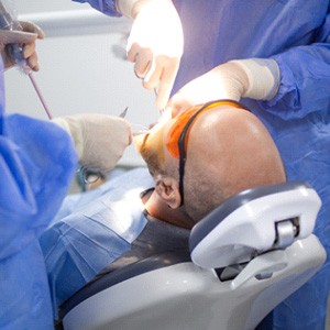 Patient in Greensboro getting dental implant surgery
