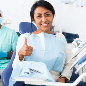 Patient in Greensboro smiling after getting their dental implant