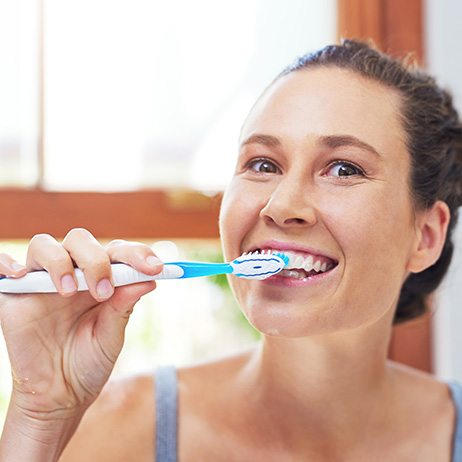 Woman brushing her teeth